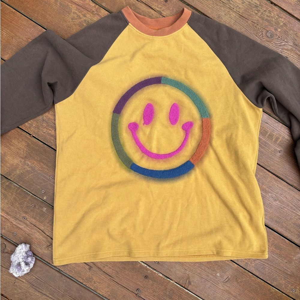Yellow and Brown Smiley Face Sweatshirts with Bold Graphic Designs, distressed